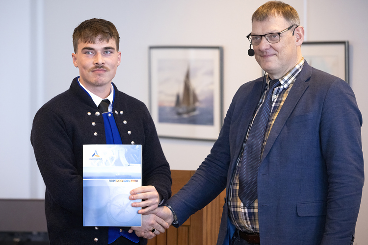 a couple of men holding a black box