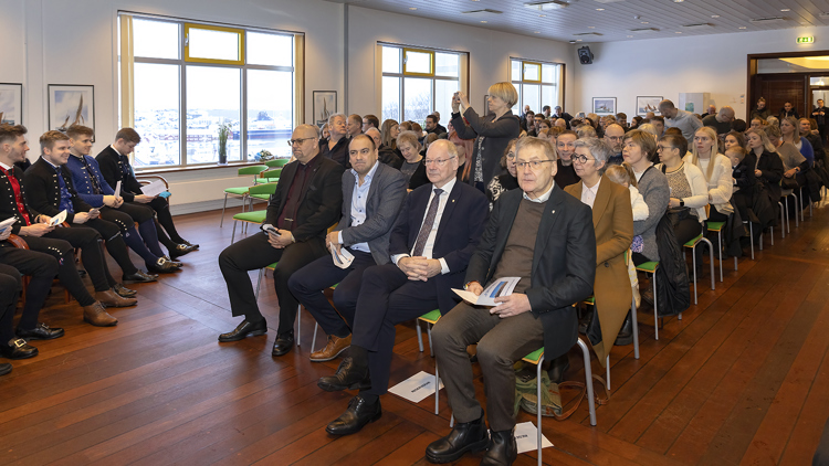 a group of people sitting in a room
