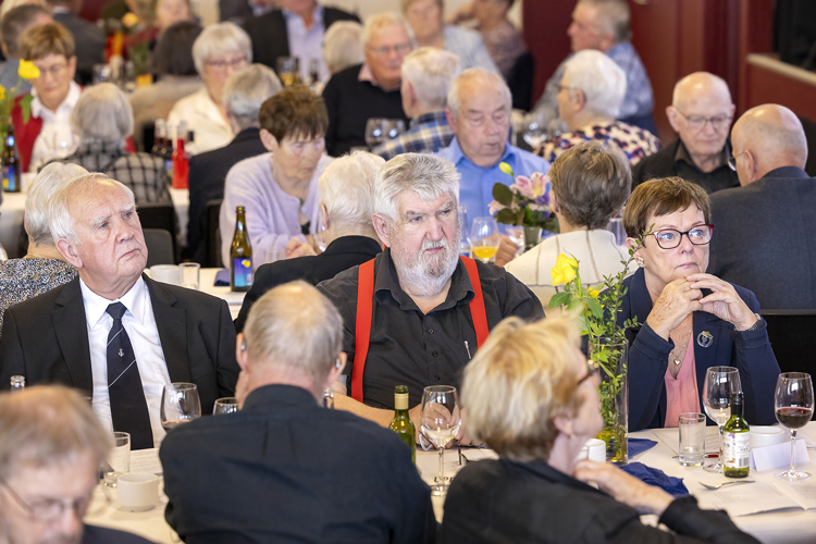 a group of people sitting at tables