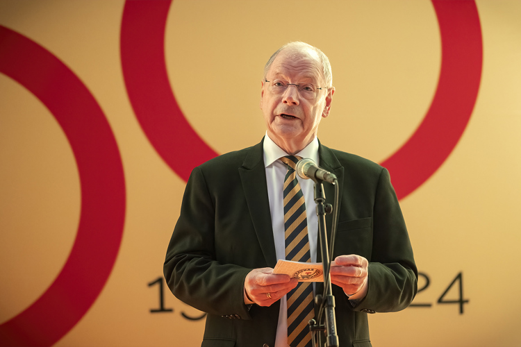 a man standing at a podium
