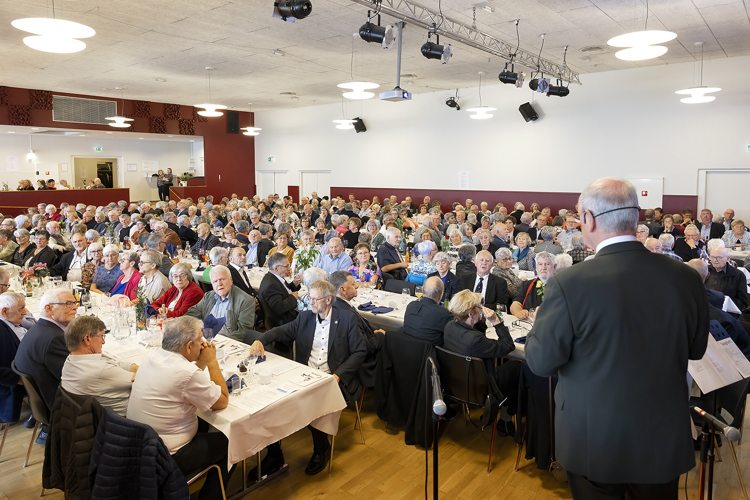 a group of people sitting at tables